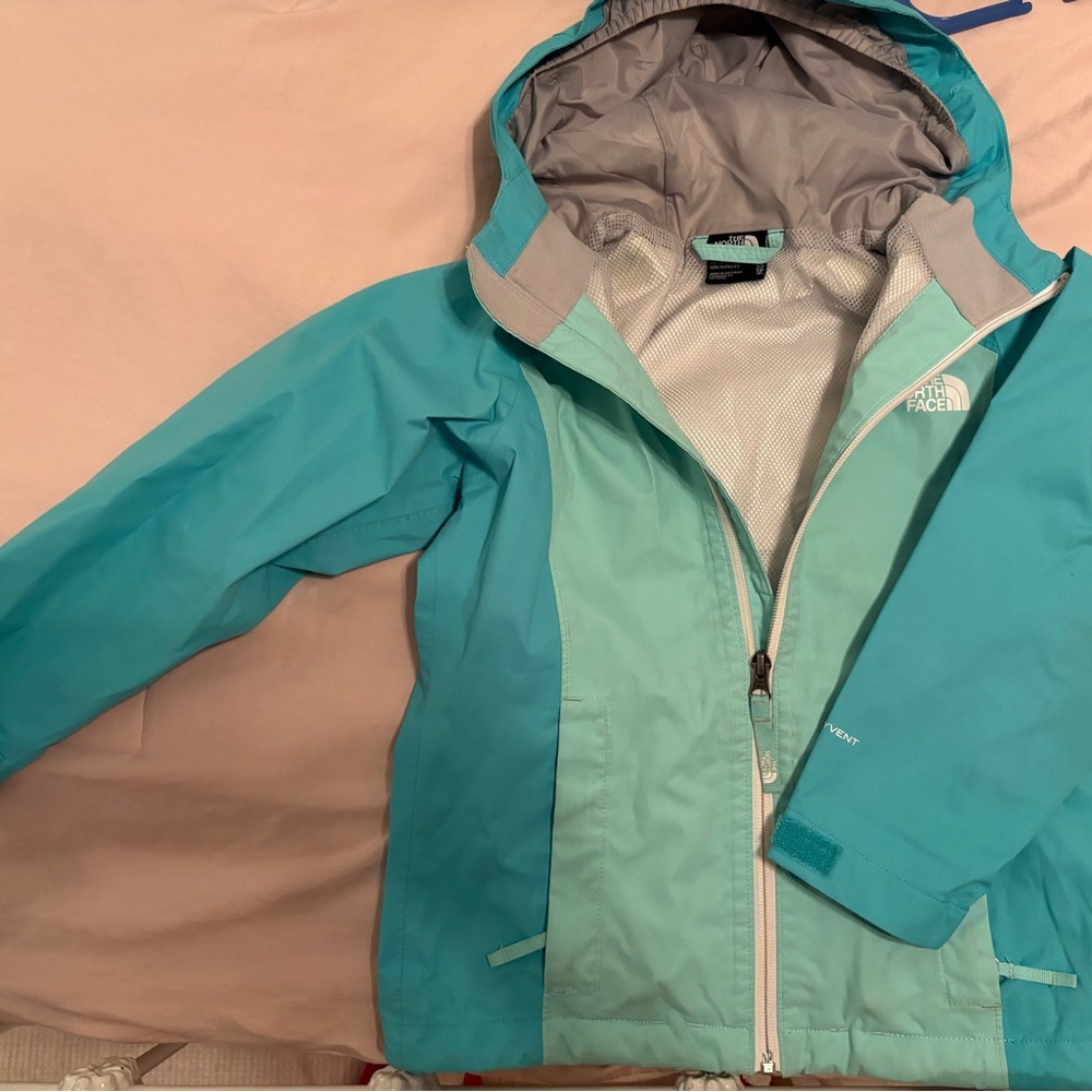 The North Face Blue and Gray Raincoat with Hood and Water-Resistant Finish